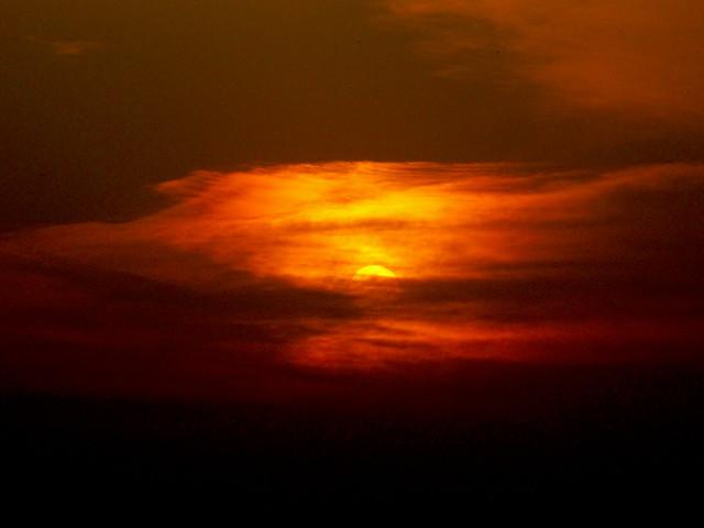 Sunset behind the clouds