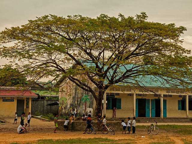 School Days - Children playing under a tree in Sihanoukville, Cambodia