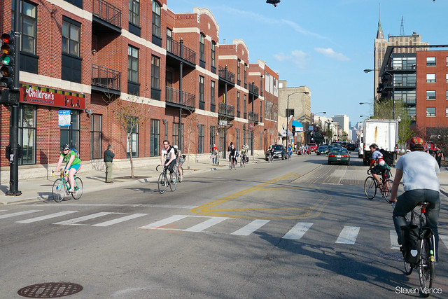 People bicycling on Milwaukee Avenue at Wabansia Avenue