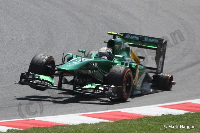 Giedo van der Garde's car afer losing a wheel at the 2013 Spanish Grand Prix