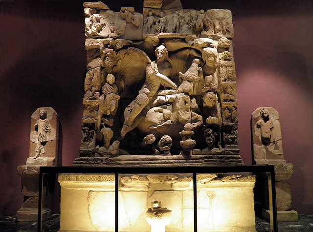 Bas-relief portraying the bull-slaying scene with figures of the two torchbearers on either side (CIMRM 966), found at the Sarrebourg (Pons Saravi) mithraeum in 1895, Musée de la Cour d'Or, Metz (France)