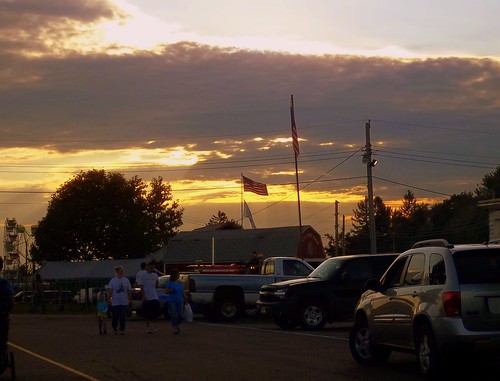 trees sunset sky usa sun tree festival wisconsin clouds fun parkinglot pretty flag scenic americanflag pickup fair pickuptruck pole powerlines entertainment wires suv countyfair powerpole wi usflag electricpole paved electriclines neillsville crossover usaflag communityevent unitedstatesflag clarkcounty clarkcountyfair parkingarea