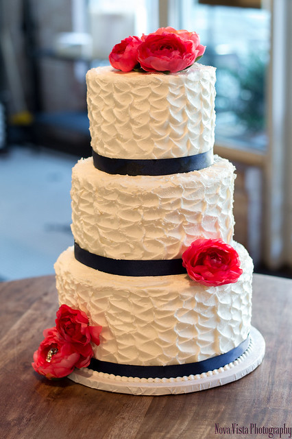 Rough Iced with Roses Tiered Wedding Cake)