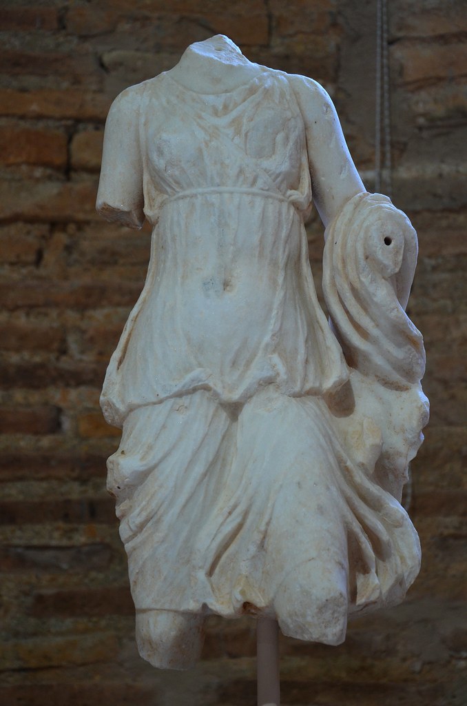 Marble headless torso of a statuette of Artemis, from the Long Stoa, late Hellenistic period, Archaeological Museum of Sikyon, Greece