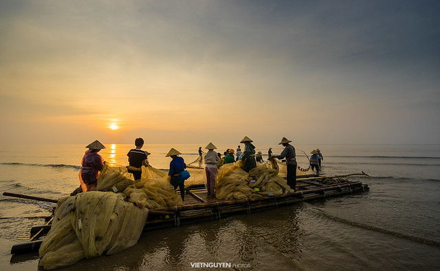 Traditional fishermen are pulling the seine (fishing net) from the sea