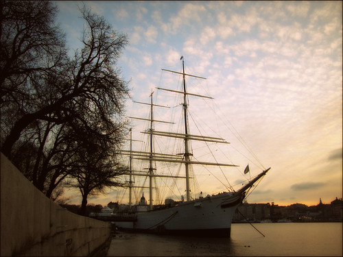afchapman stockholm sweden sky quay ship trees evening sunset water strömmen skeppsholmen hostel tallship