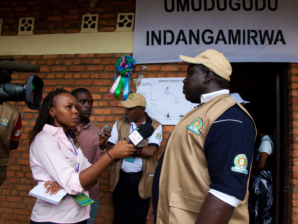 A journalists interviewing voters at the Parliamentary elections - Kigali, 16 September 2013