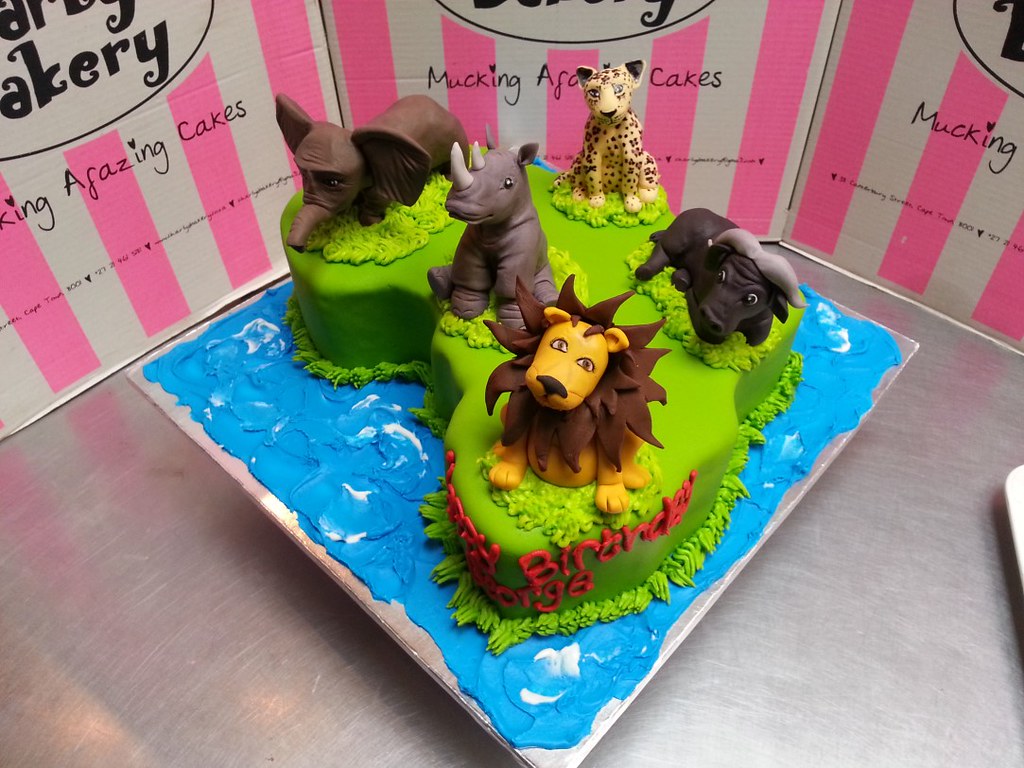 Africa shaped cake with 3D fondant toppers of the
