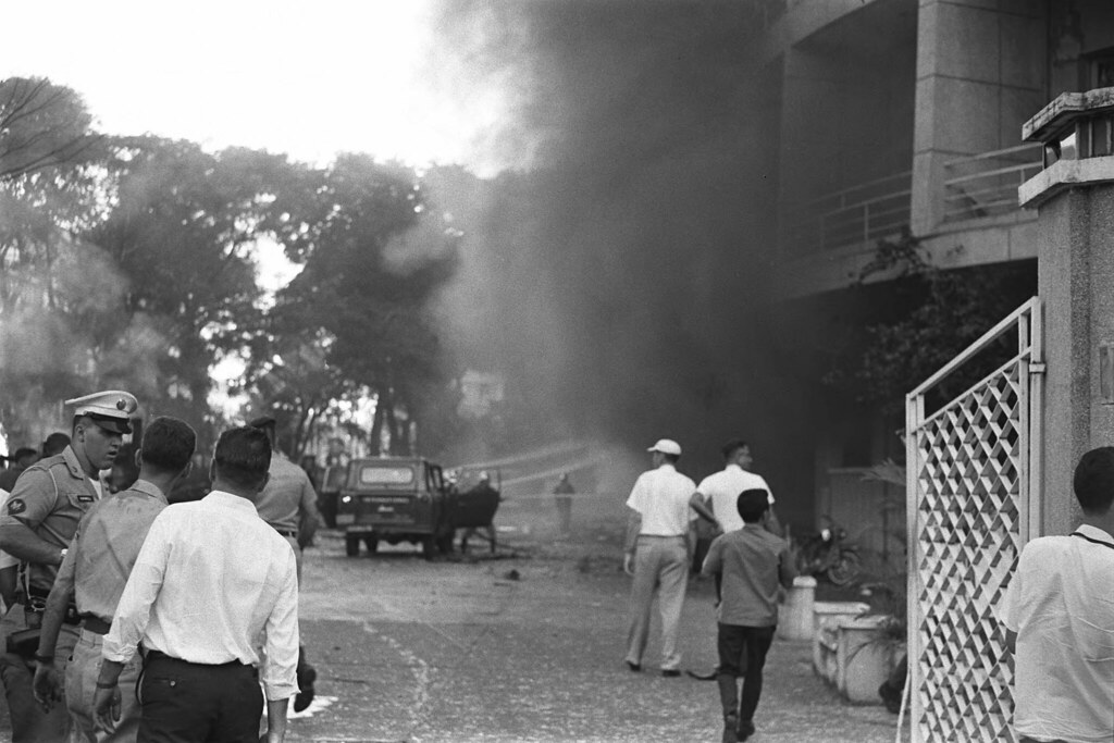 The Brink Hotel goes up in flames after Vietcong terrorist attempt, 24 December 1964 - by Francois Sully