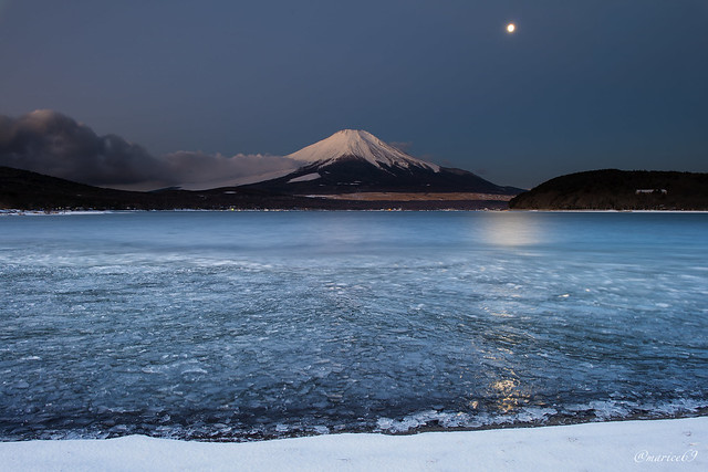 A lake and Mt.Fuji and moon which froze