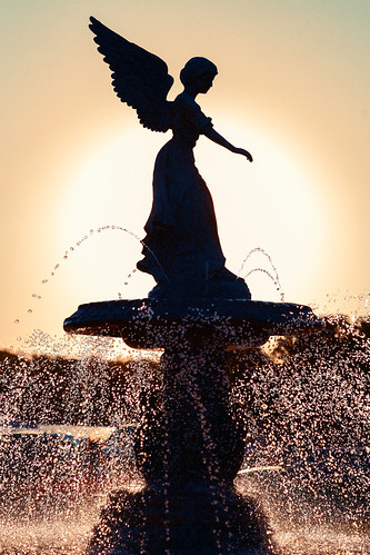 park city travel sunset summer sunlight hot art water fountain beautiful weather silhouette statue vertical stone wisconsin architecture female angel backlight contrast outside droplets drops warm downtown day dusk scenic nobody landmark scene spray falling entertainment heat figure lakeshore leisure flowing backlit copyspace winged wi waterworks tranquil lakegeneva sprinkle angelofthewaters squirting rivierabeach colorimage walworthcounty lighthappiness thelegendofthefountain