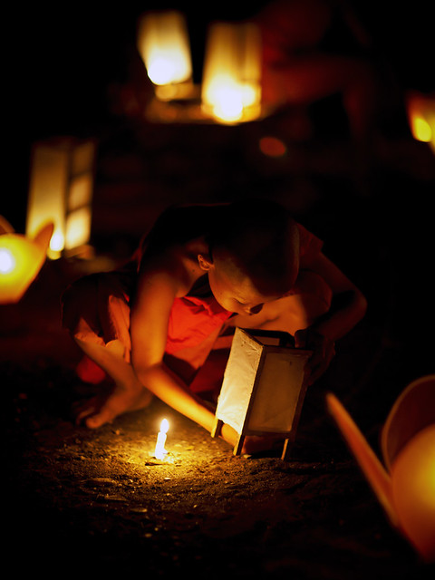 Lighting a candle - Laos