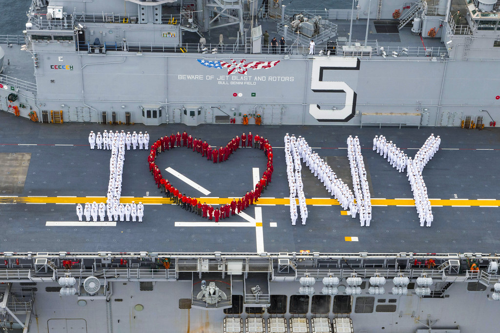 Sailors onboard USS Bataan pose for a "I heart New York" photograph in preparation for Fleet Week New York.