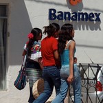 Women walking by the bank; Ocosingo, Chiapas, Mexico