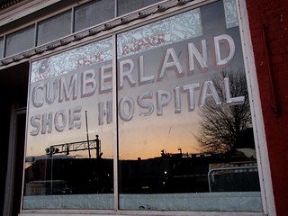 Reflection of sunset on Cumberland Shoe Hospital window
