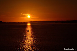 Speedboat across the sunset