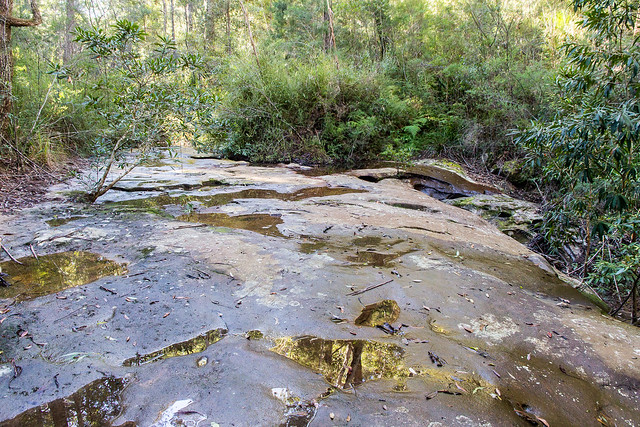 Creek crossing with pools and grinding grooves
