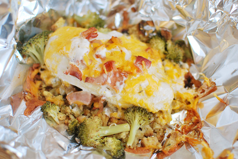 Cheesy Chicken Hobo Packets - stuffing, chicken, broccoli, bacon, and cheese all layered and cooked in foil packets. They can be cooked in the oven or on the grill. Easiest dinner ever!