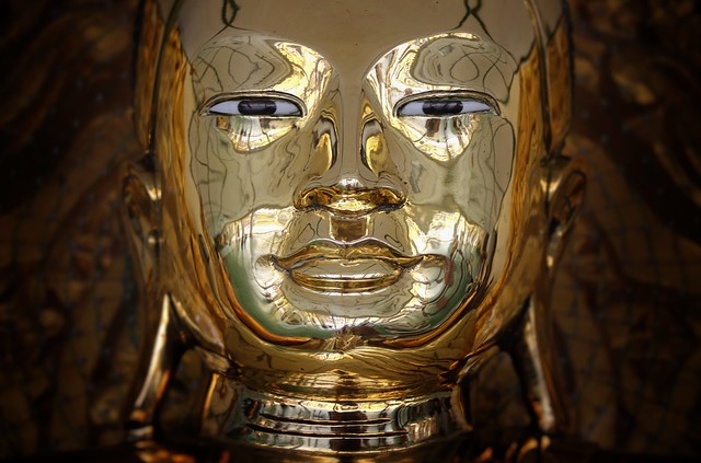 The eyes of the golden Buddha mark its intentions