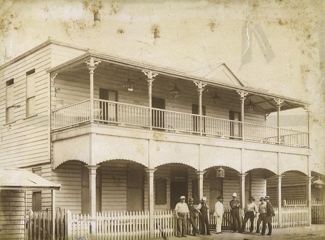 Unidentified men gathered outside the School of Arts Building, Charters Towers