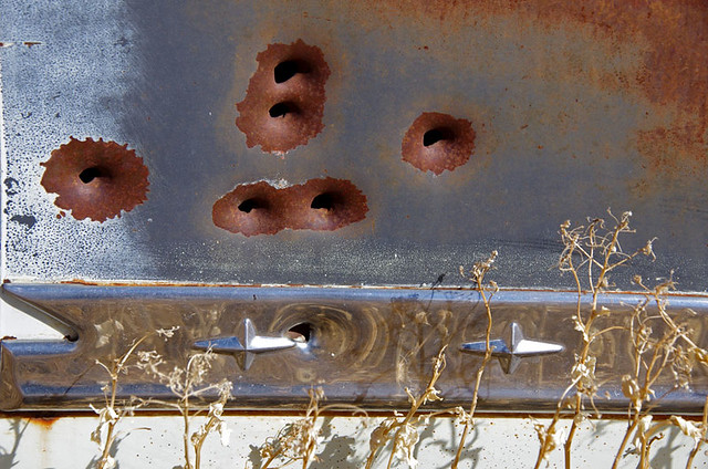 Bullet holes in an abandoned Pontiac at Tuscarora, Nevada