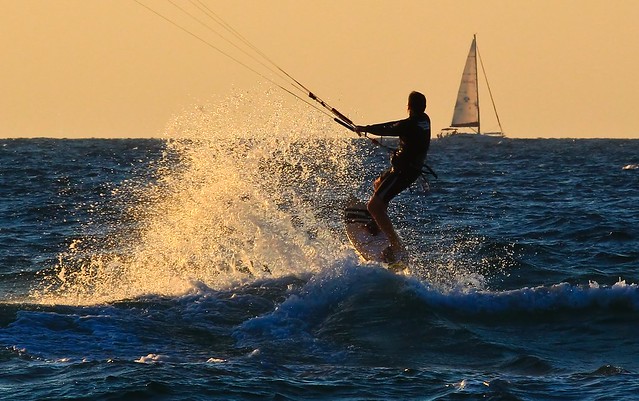 kitesurfer & sailboat on sunset