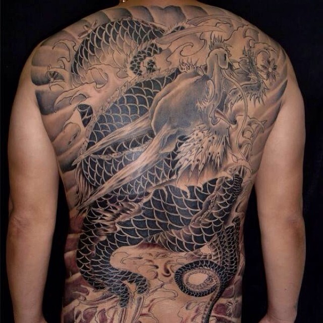 Orange And Black Japanese Dragon Half Sleeve And Chest Tattoo On Man |  Dragon sleeve tattoos, Dragon tattoo designs, Half sleeve tattoos for guys