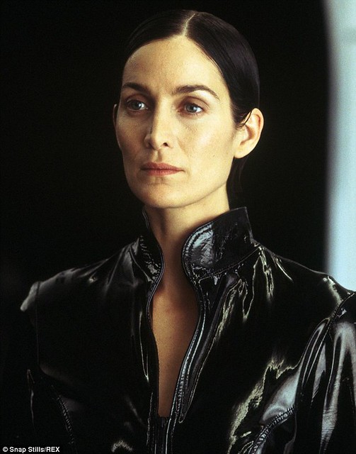 Carrie-Anne Moss in vinyl catsuit