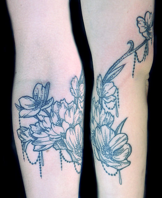 ornamental flower dotwork tattoo