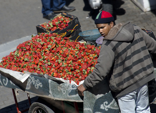 Strawberry Trader - Morocco street trader with barrow of strawberries