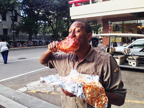 Reggie White of New Orleans shows how to eat a BBQ turkey leg at Crescent City Blues & BBQ Fest