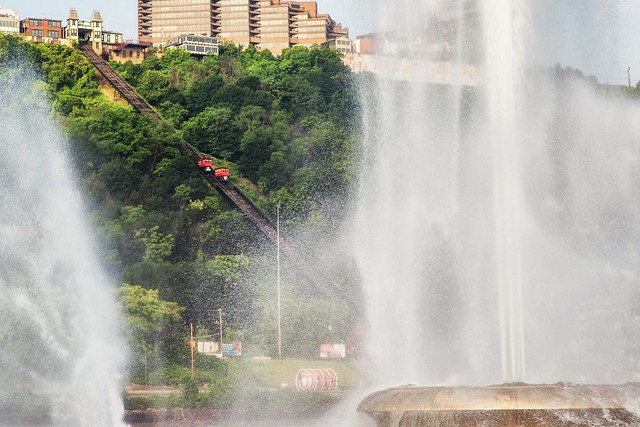 The Duquesne Incline cars seen through the fountain at Point State Park in Pittsburgh