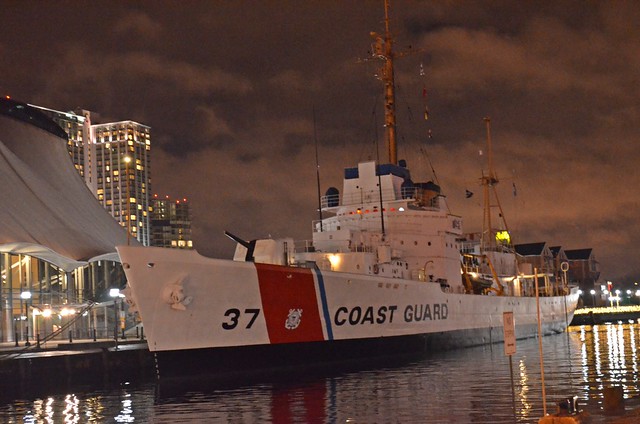 US Coast Guard Ship 37 under an evening rainy sky