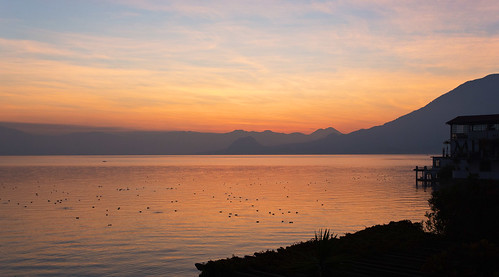 orange lake reflection water sunrise volcano fishing guatemala atitlan sanpedro lakeatitlan sanpedrolalaguna