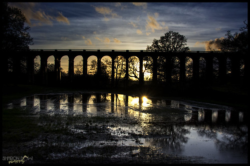 uk bridge sunset england sky sun reflection building wet water field architecture clouds puddle sussex nikon skies haywardsheath westsussex britain bricks viaduct architect railwayline engineer balcombe flooded englishheritage ousevalley balcombeviaduct ousevalleyviaduct gradeiilistedbuilding brightonmainline johnurpethrastrick railwayheritagetrust nikond7100 sharondowphotography