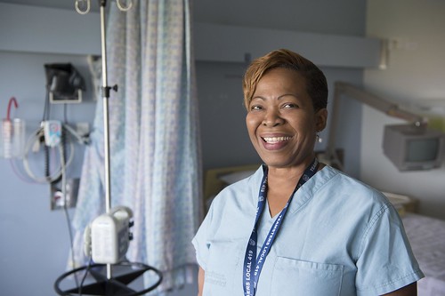 Female Nurse Smiling inside Hospital Room / Infirmière souriante dans une chambre d’hôpital