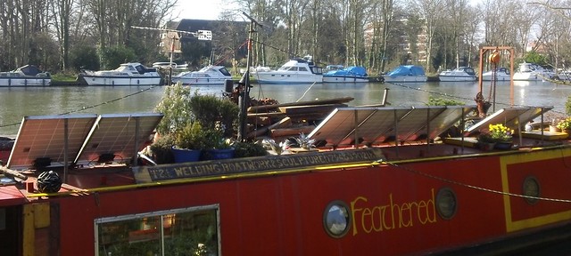 'Feathered' Thames canal boat with solar panels and rooftop garden near Kingston