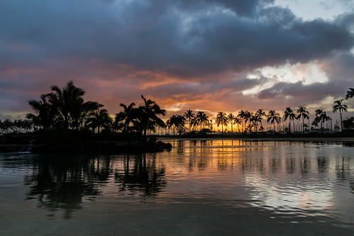 sunset reflection water rain silhouette clouds landscape hawaii cloudy waikiki lagoon palmtrees getty honolulu hiltonhawaiianvillage