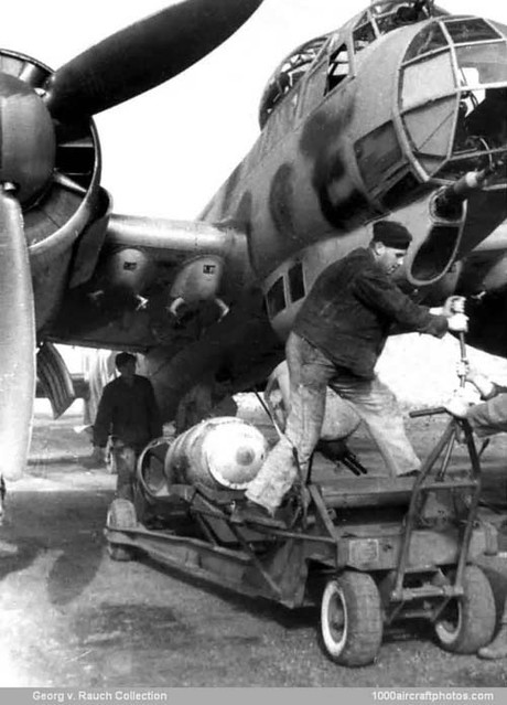 Junkers Ju 88 A-4 - Ground-crew lifting a bomb to be attached to a wing hard-point on this aircraft of the LG 1