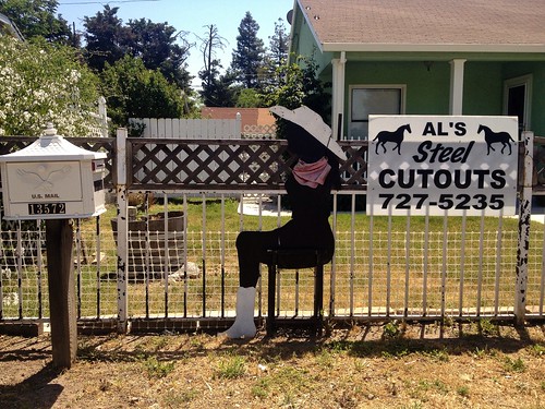 street shadow sculpture signs hat silhouette sign mailbox yard rural fence cutout landscape countryside artwork cowboy iron artist sitting view boots steel crafts country decoration lawn arts scenic front neighborhood business ornament figure cutouts posture cowgirl roadside bandana shape als shapely womanofsteel