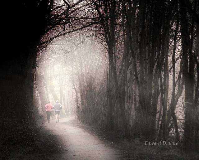 Runners in the mist.