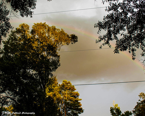 Putt_130706_0064 by Puttknob, Didn't realize there was a rainbow until after I processed the photo. I just liked the way the light