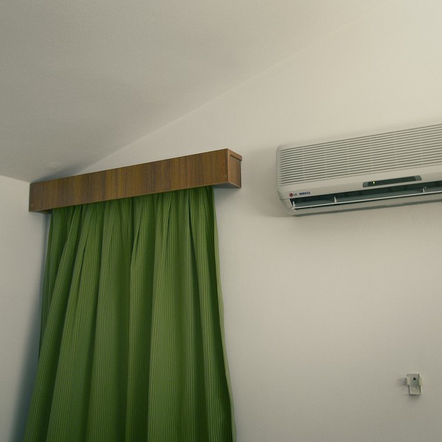 Curtain, aircon and aircon remote holder.