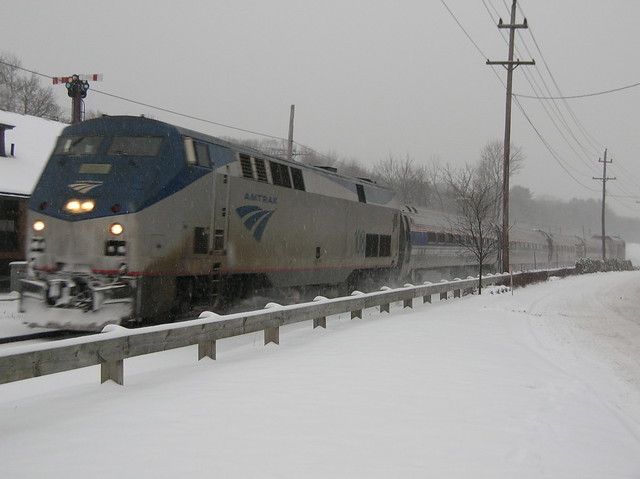Amtrak P42 No. 108 leads eastbound Downeaster past the old station in Andover, Mass. on a snowy January 6, 2005 afternoon