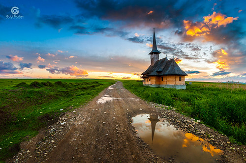 church cross orthodoxy puddle reflection road dirt clouds sunset field grass water sky stones rustic puddles tower skyline colors spring infinity landscape dusk