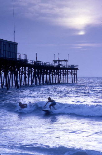 Surfers at the Canaveral Pier in Cocoa Beach