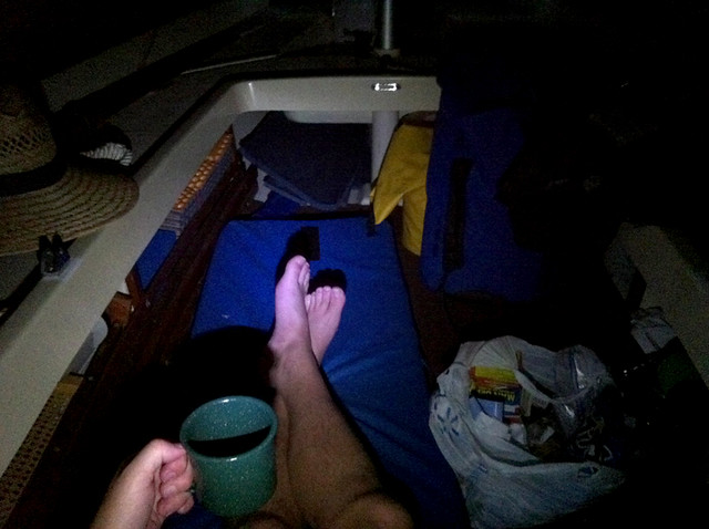 Stockton Lake - Rum and cola under my tarp canopy. Between the shot of rum, mild movement of the boat and having rowed and sailed for two hours under the moonlight, I slept like a baby.