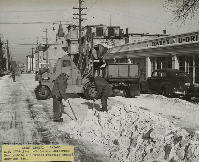 1950-feb-2_crew-by-trucks-and-scoopmobile-for-snow-removal-on-sw-12th-ave-between-main-and-jefferson-st_a2000-025-2459