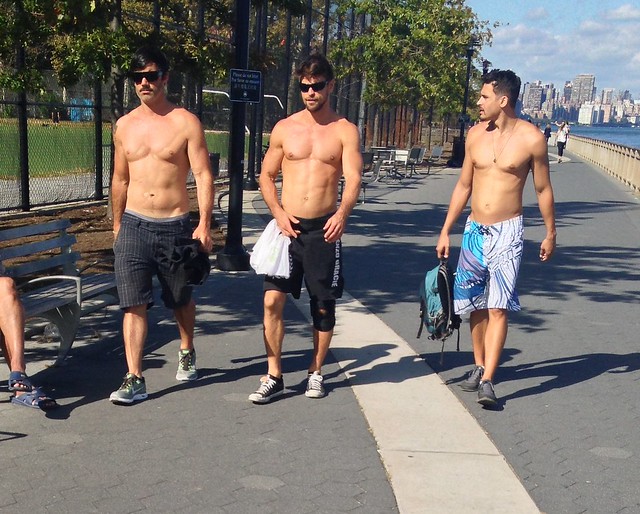 Shirtless Men Walking Along East River New York