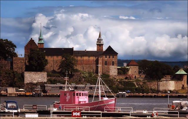 Oslo harbour - Akershus castle with a red shrimp trawler